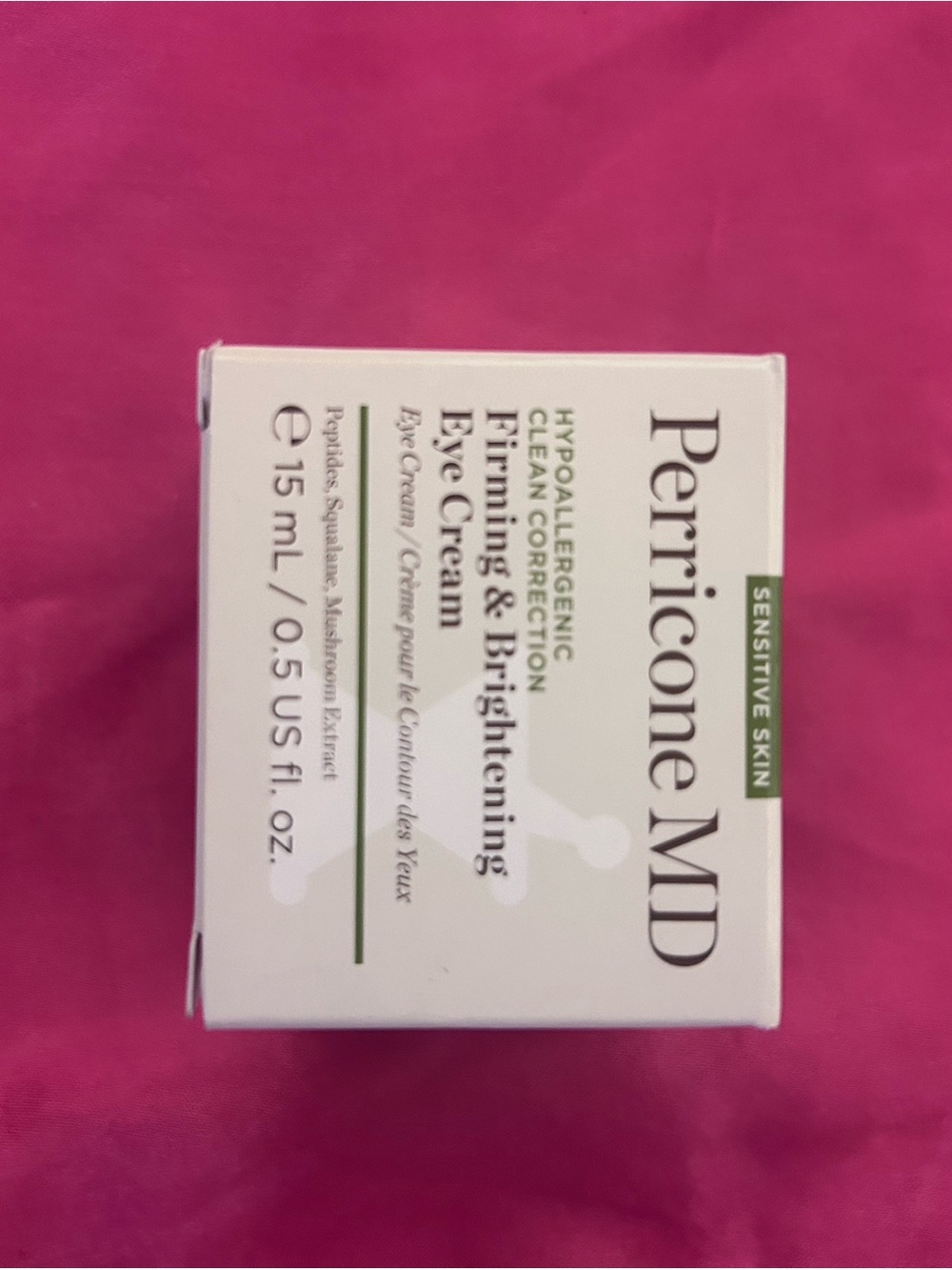 Perricone MD Eye Cream Box - White with Green Accents on Pink Background